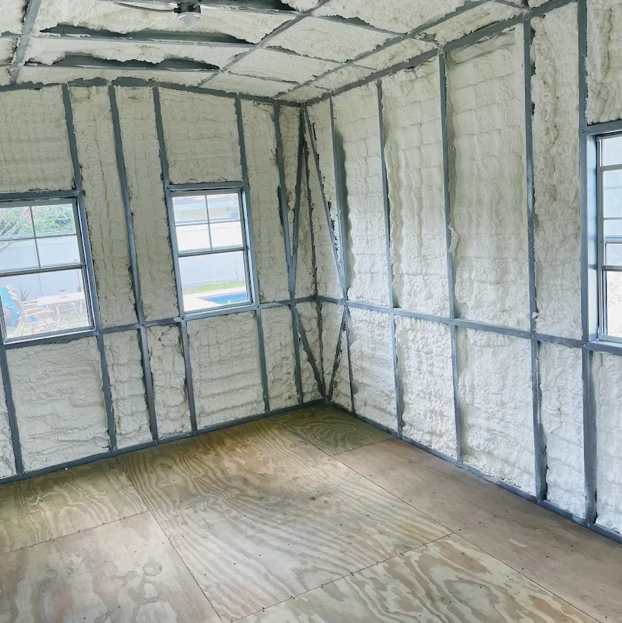 Closed-cell spray foam insulation applied to wall cavities in a residential project in Hallsville